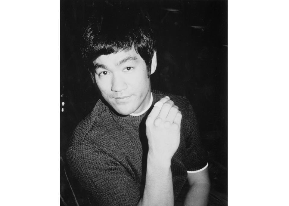 This image released by ESPN Films shows Bruce Lee, the subject of the the documentary "Be Water." The film, which details the movie star's tragically short career, captures the cool power of Lee, an early Asian American big-screen hero. It airs Sunday at 9 p.m. EDT on ESPN as part of the network's “30 for 30” documentary series. (Bruce Lee Family Archive/ESPN Films via AP)