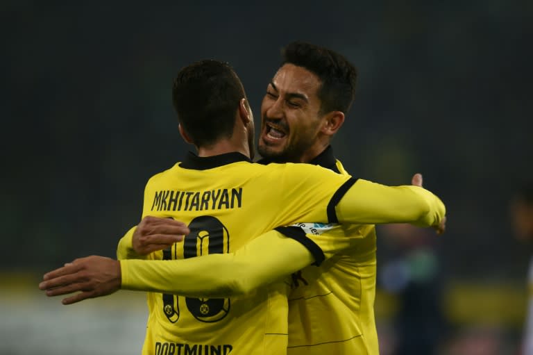 Dortmund midfielders Henrikh Mkhitaryan (L) and Ilkay Guendogan celebrate the third goal during the Bundesliga match at Moenchengladbach on January 23, 2016