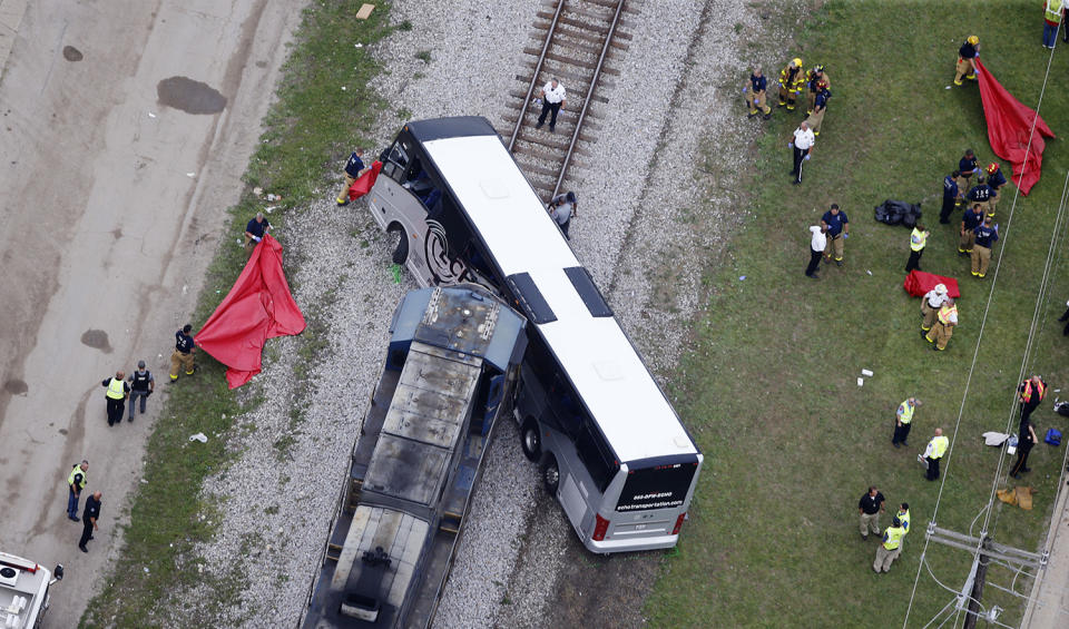 Train hits bus, killing 4