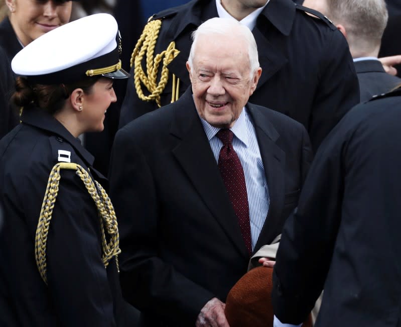 FILE PHOTO: Former president Jimmy Carter arrives at inauguration ceremonies swearing in Donald Trump as the 45th president of the United States on the West front of the U.S. Capitol in Washington