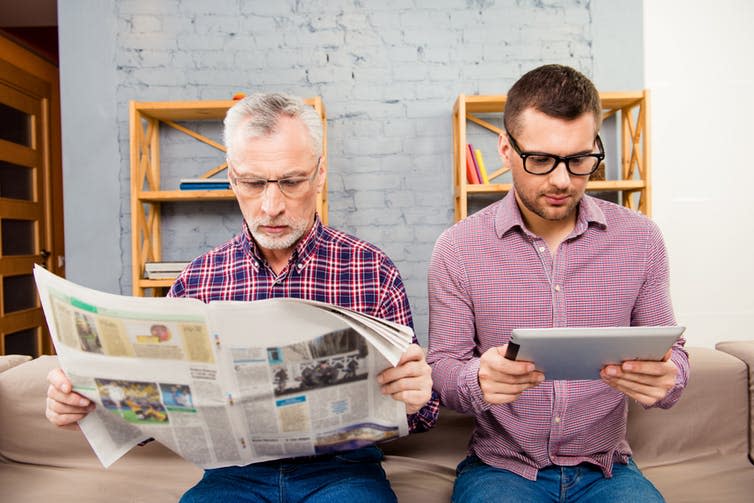 <span class="caption">Can lifestyle factors like reading, exercise and socialising protect us from our genetic risks as we age?</span> <span class="attribution"><a class="link " href="https://www.shutterstock.com/image-photo/old-father-reading-newspaper-his-son-407783782?src=x4nybLT4uGKUNNhWfSncQA-1-4" rel="nofollow noopener" target="_blank" data-ylk="slk:RomanSamborskyi/Shutterstock;elm:context_link;itc:0;sec:content-canvas">RomanSamborskyi/Shutterstock</a></span>