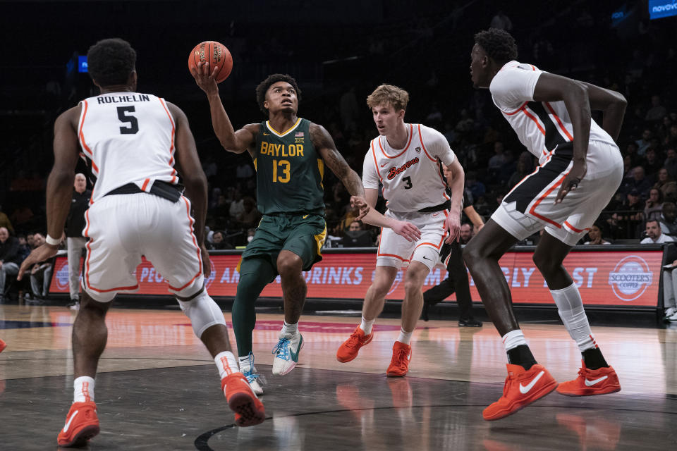 Baylor guard Langston Love (13) drives to the basket against Oregon State during the second half of an NCAA college basketball game Wednesday, Nov. 22, 2023, in New York. (AP Photo/Eduardo Munoz Alvarez)