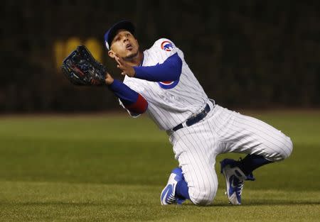 FILE PHOTO: Oct 18, 2017; Chicago, IL, USA; Chicago Cubs left fielder Jon Jay makes a catch on a ball hit by Los Angeles Dodgers first baseman Cody Bellinger (not pictured) in the seventh inning in game four of the 2017 NLCS playoff baseball series at Wrigley Field.