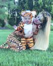 Khloé cuddled up to her cute cub during their Halloween photo-op. 