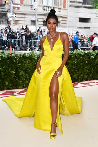 <p>Frazer Harrison/FilmMagic</p> Gabrielle Union in a vibrant yellow Prabal Gurung gown at the Met Gala in 2018,
