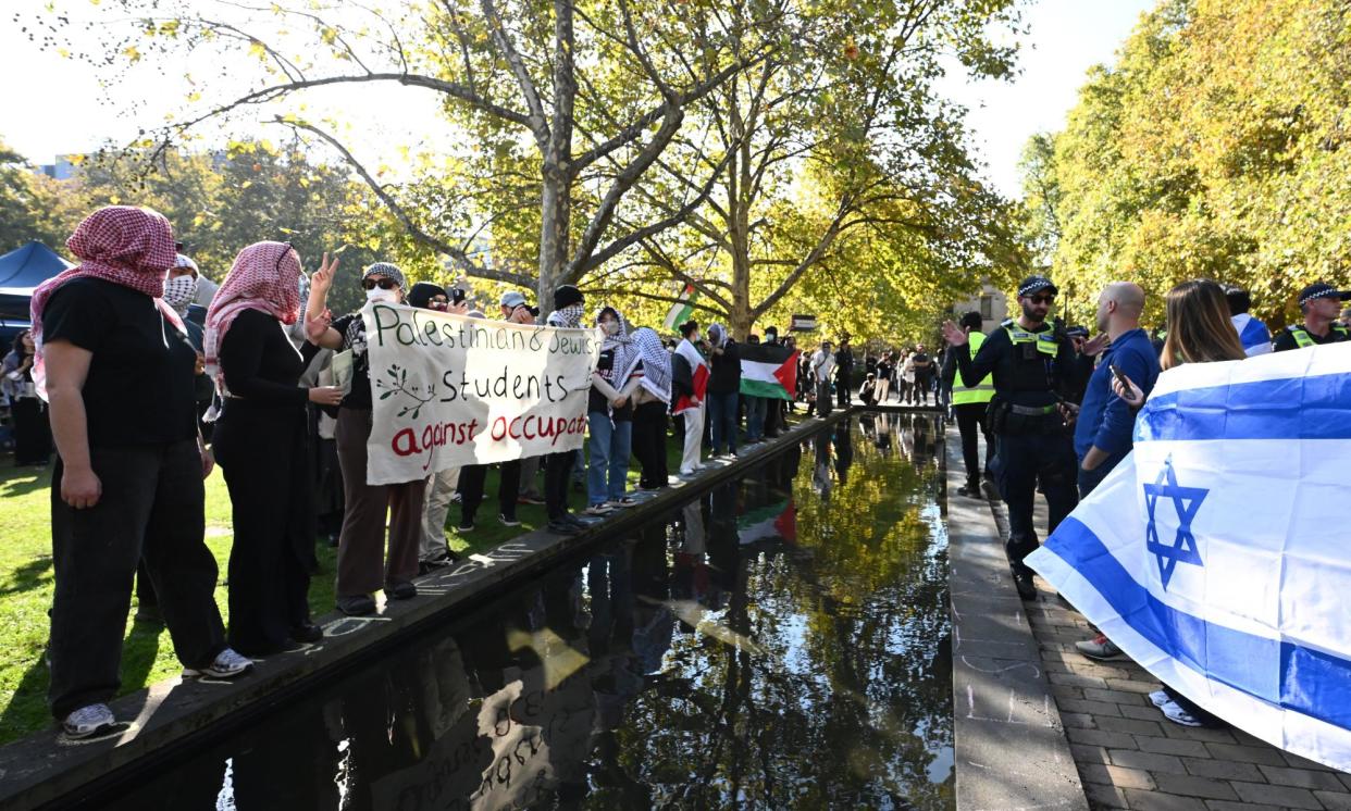 <span>Members of the Jewish community gather opposite a Pro-Palestine encampment at the University of Melbourne on 2 May, 2024. </span><span>Photograph: Joel Carrett/AAP</span>