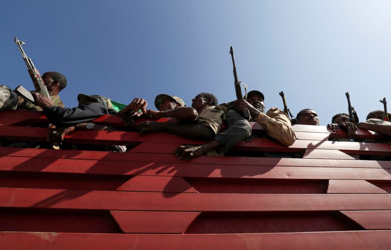 FILE PHOTO: Members of Amhara region militias ride on their truck as they head to the mission to face the Tigray People's Liberation Front in Sanja