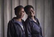 Latifa Mustapha Muhamed, 30, left, and Suana Esezobor, 22, right, both from Nigeria, pose for a portrait aboard the humanitarian rescue ship Ocean Viking, in Italian waters off the Sicilian town of Messina, southern Italy, Monday, Sept. 23, 2019, hours before disembarking. Latifa and Suana are not blood relatives but call themselves sister of the heart. They’ve supported each other throughout the journey and are always together. (AP Photo/Renata Brito)