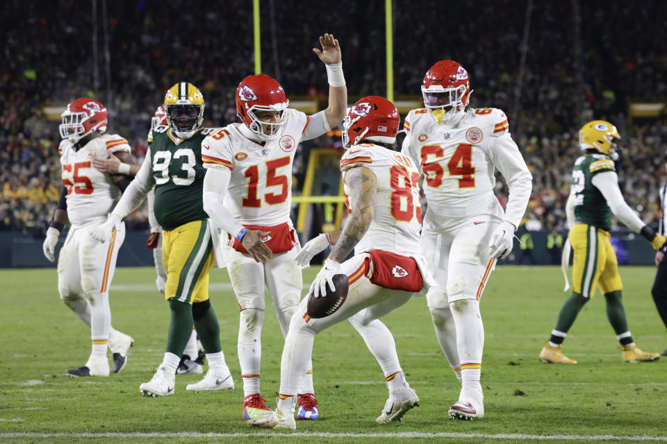 Kansas City Chiefs tight end Noah Gray (83) celebrates his two-yard touchdown reception with quarterback Patrick Mahomes (15) against the Green Bay Packers during the second half of an NFL football game Sunday, Dec. 3, 2023 in Green Bay, Wis. (AP Photo/Mike Roemer)