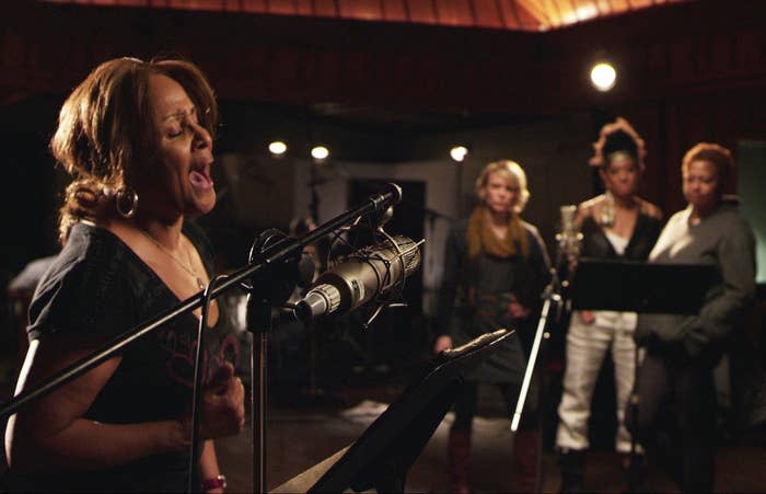 Darlene Love singing at a mic in a recording studio in 20 feet From Stardom