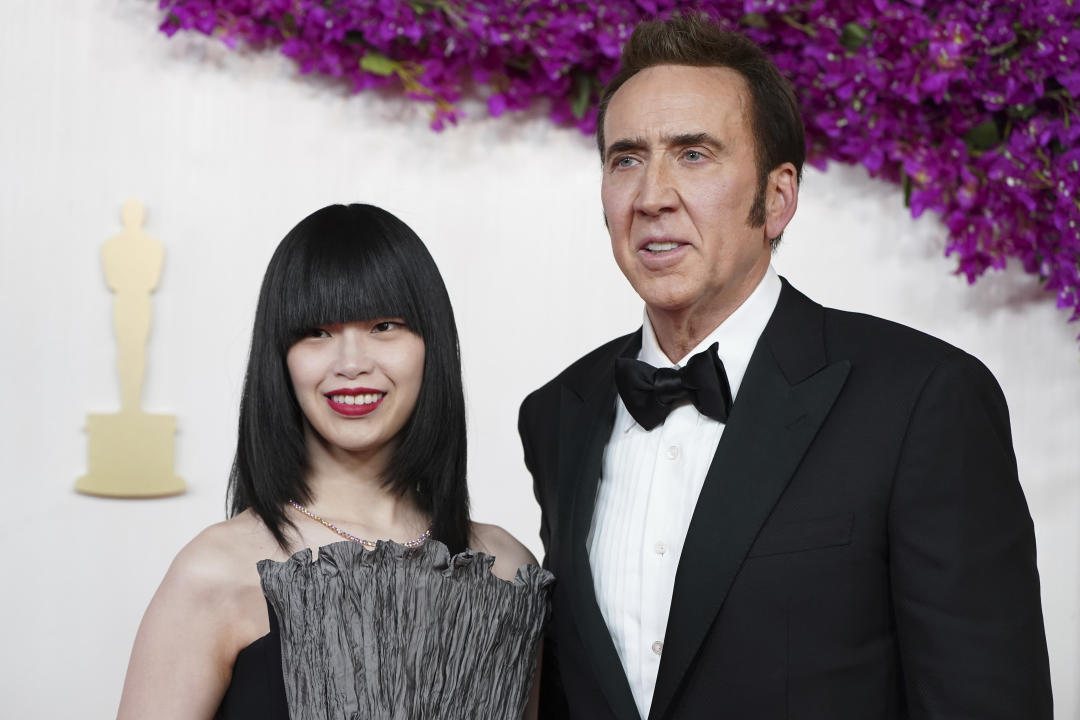Riko Shibata, left, and Nicolas Cage arrive at the Oscars on Sunday, March 10, 2024, at the Dolby Theatre in Los Angeles. (Photo by Jordan Strauss/Invision/AP)