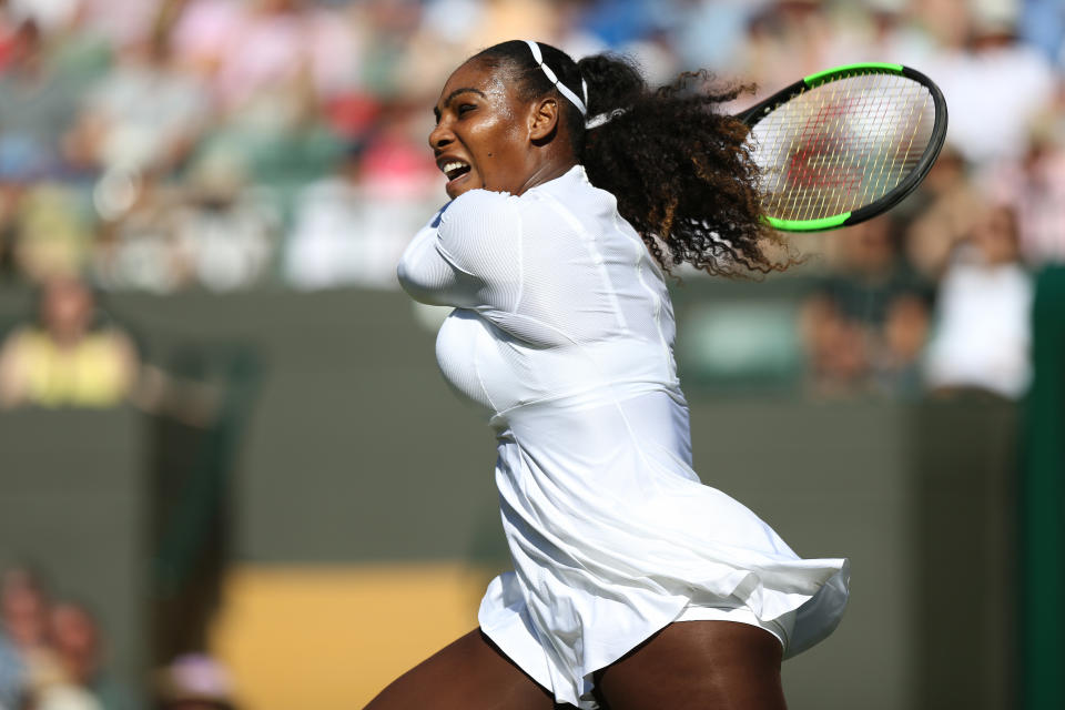 Serena Williams slugs a shot in her victory over Aranxta Rus on Monday at Wimbledon. (John Patrick Fletcher via Getty Images)