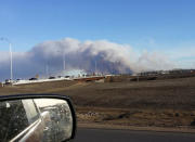 Vehicles are seen on highway 63 as they are detoured near wildfire burning near Fort McMurray, Alberta May 1, 2016. Courtesy Gregory Hong/Handout via REUTERS