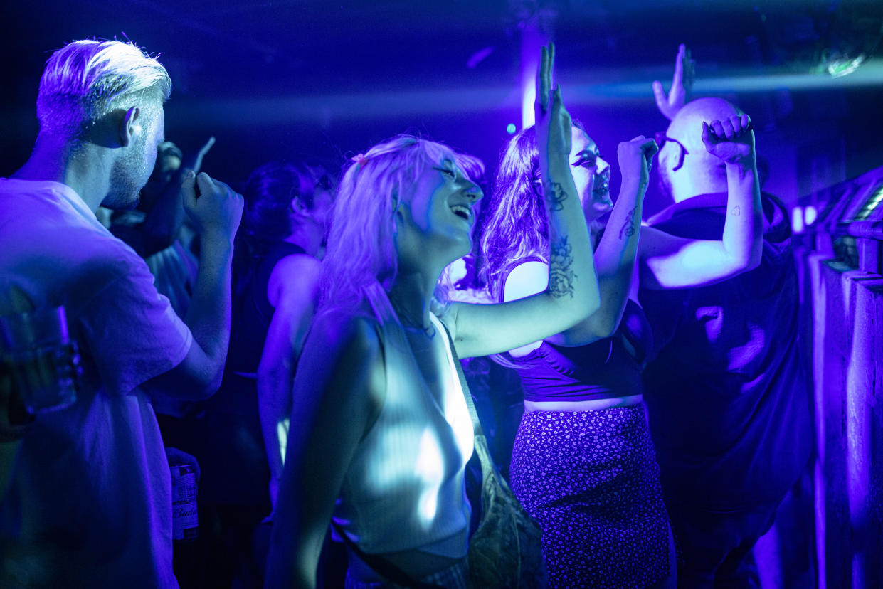 LONDON, ENGLAND - JULY 19: People dancing at Egg London nightclub in the early hours of July 19, 2021 in London, England. As of 12:01 on Monday, July 19, England will drop most of its remaining Covid-19 social restrictions, such as those requiring indoor mask-wearing and limits on group gatherings, among other rules. These changes come despite rising infections, pitting the country's vaccination programme against the virus's more contagious Delta variant. (Photo by Rob Pinney/Getty Images)