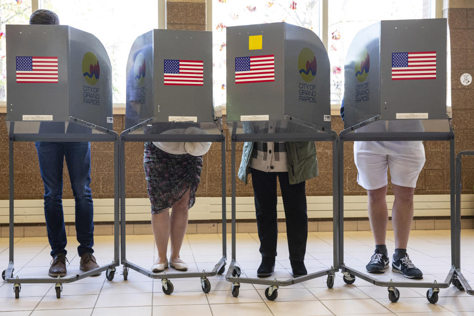 FILE - People cast their ballots at Coit Arts Academy in Grand Rapids on Nov. 8, 2022. A nonprofit that became a point of controversy for distributing hundreds of millions of dollars in election grants during the 2020 presidential campaign is releasing a fresh round of money to local election offices, including in states where Republican lawmakers tried to ban the practice. (Joel Bissell/The Grand Rapids Press via AP)