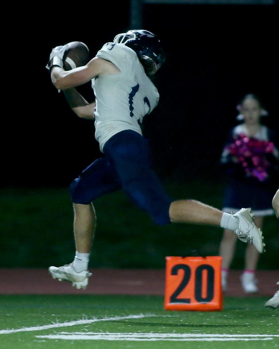 Cohasset's Will Norgeot makes a spectacular catch at the end of the second quarter of their game at Carver Middle High School on Friday, Oct. 6, 2023. Carver would go on to win 42-39 in overtime.