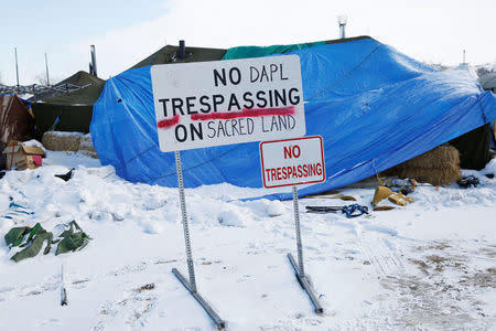 A modified "No Trespassing" sign is seen in the opposition camp against the Dakota Access oil pipeline (DAPL) near Cannon Ball, North Dakota, U.S., February 8, 2017. REUTERS/Terray Sylvester