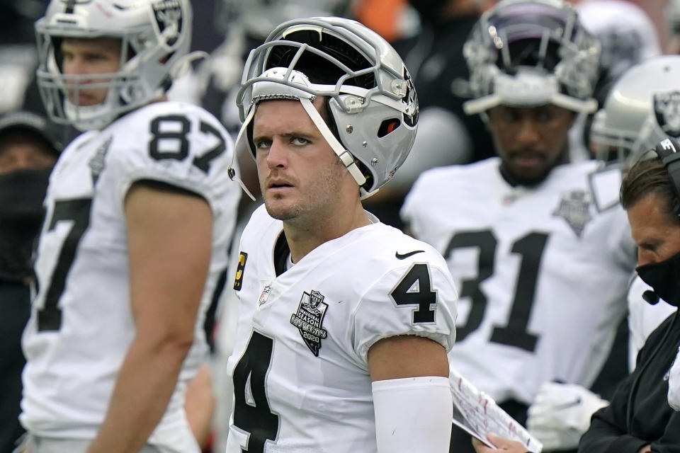 Las Vegas Raiders quarterback Derek Carr watches from the sideline in the second half of an NFL football game against the New England Patriots, Sunday, Sept. 27, 2020, in Foxborough, Mass. (AP Photo/Steven Senne)