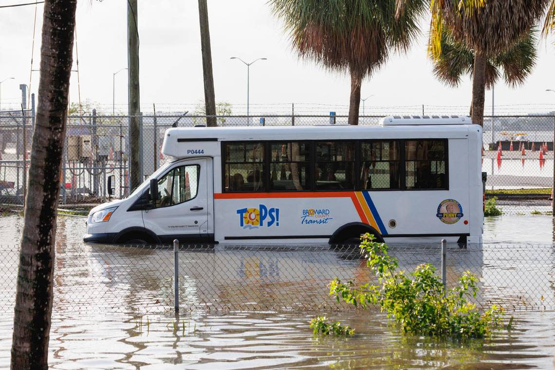 A Broward County TOPS vehicle submerged in flooded street caused by heavy rain on West Perimeter Road in Fort Lauderdale on Thursday, April 13, 2023.