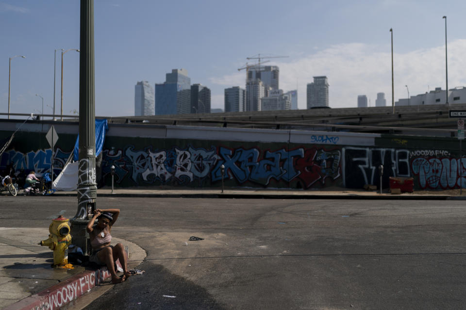 Luisa Gibson, 20, bathes using water from a fire hydrant in Los Angeles, Wednesday, July 27, 2022. Drug abuse can be a cause or symptom of homelessness. Both can also intersect with mental illness. A 2019 report by the Los Angeles Homeless Services Authority found about a quarter of all homeless adults in Los Angeles County had mental illnesses and 14% had a substance use disorder. That analysis only counted people who had a permanent or long-term severe condition. Taking a broader interpretation of the same data, the Los Angeles Times found about 51% had mental illnesses and 46% had substance use disorders. (AP Photo/Jae C. Hong)