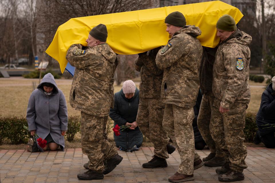 Ukrainian servicemen carry the coffin of Volodymyr Hurieiev, a fellow soldier killed in the Bakhmut area, during the funeral in Boryspil, Ukraine, Saturday, 4 March 2023 (AP)