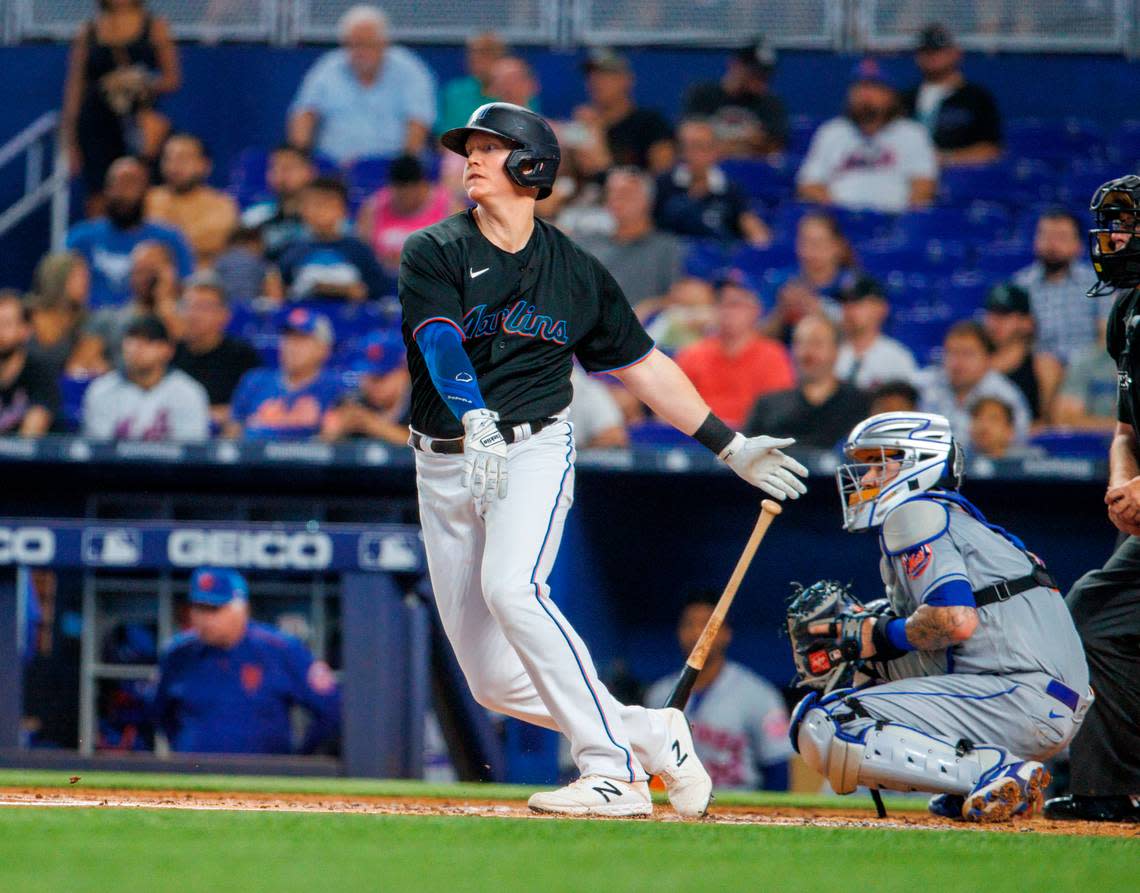 Miami Marlins designated hitter Garrett Cooper (26) hits an RBI single during the first inning of a baseball game against the New York Mets at LoanDepot Park on Friday, June 24, 2022 in Miami, Florida.