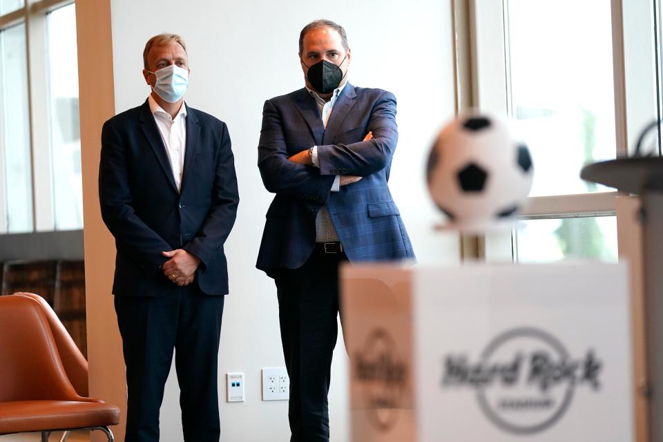 Colin Smith, FIFA chief tournaments & events officer, left, and Victor Montagliani, FIFA vice president and CONCACAF president, right, listen during a news conference at Hard Rock Stadium, Thursday, Sept. 23, 2021, in Miami Gardens, Fla. FIFA representatives are visiting FIFA World Cup 2026 candidate host cities. (AP Photo/Lynne Sladky) ORG XMIT: OTK