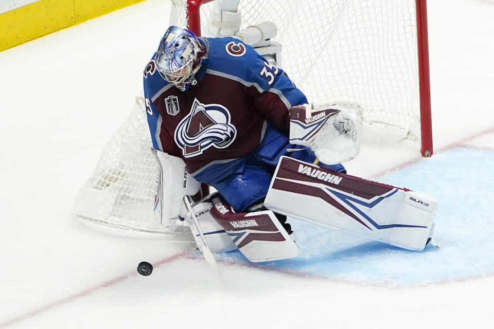 Colorado Avalanche goaltender Darcy Kuemper stops a Tampa Bay Lightning shot during the third period of Game 1 of the NHL hockey Stanley Cup Final on Wednesday, June 15, 2022, in Denver. (AP Photo/John Locher)