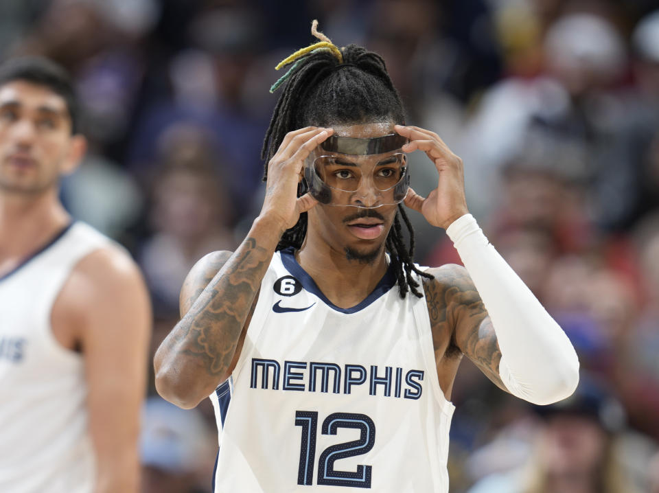 FILE - Memphis Grizzlies guard Ja Morant (12) plays in the second half of an NBA basketball game Friday, March 3, 2023, in Denver. The NBA has suspended Memphis Grizzilies guard Ja Morant eight games without pay, after determining that his holding a firearm at a club in suburban Denver earlier this month was “conduct detrimental to the league.” Morant will miss his sixth game on Wednesday, March 15, 2023, when the Grizzlies play in Miami. (AP Photo/David Zalubowski, File)