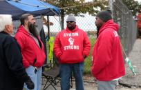 Striking United Auto Workers (UAW) member James Reynolds wears a 'Union Strong' shirt while picketing outside the General Motors Detroit-Hamtramck Assembly in Hamtramck,