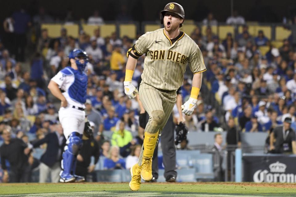 San Diego's Jake Cronenworth celebrates after hitting a solo home run during the eighth inning.