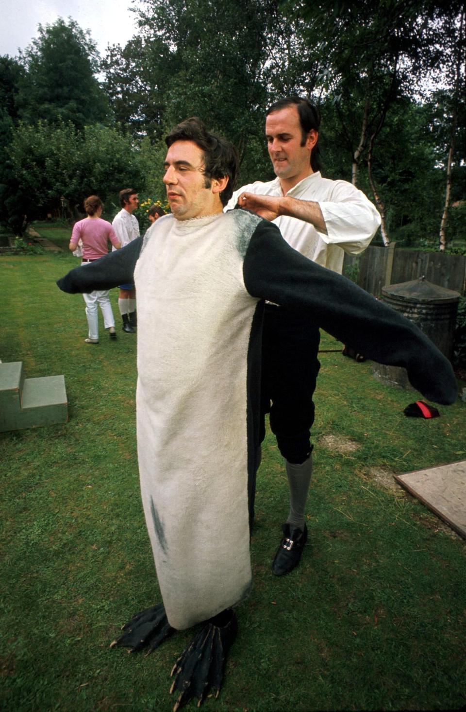 Terry Jones, right, and John Cleese, putting on costumes for a Monty Python&#39;s Flying Circus sketch.