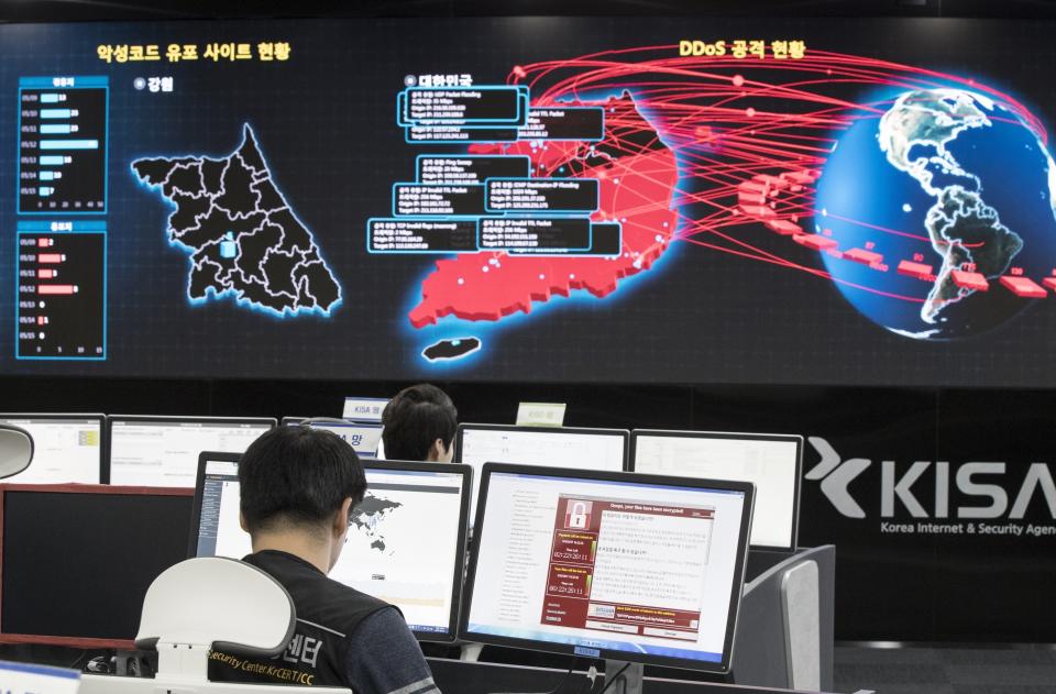 In this Monday, May 15, 2017, file photo, employees watch electronic boards to monitor possible ransomware cyberattacks at the Korea Internet and Security Agency in Seoul, South Korea. (Yun Dong-jin/Yonhap via AP, File)