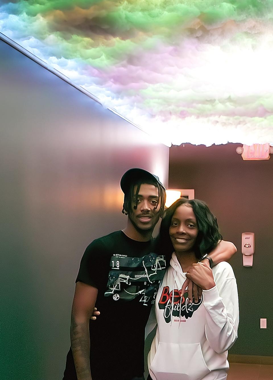 BestFriendz Selfie Studio Owner Brandi Little and her son, Brandon Chambers, show off the hallway, which has a backlit cloud ceiling. Little and her friend Bianca Segines hope to open the Streetsboro business in January or early February.