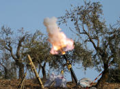 <p>Turkey-backed Free Syrian Army fighters fire a mortar in Barsaya mountain, northeast of Afrin, Syria, Jan. 28, 2018. (Photo: Khalil Ashawi/Reuters) </p>