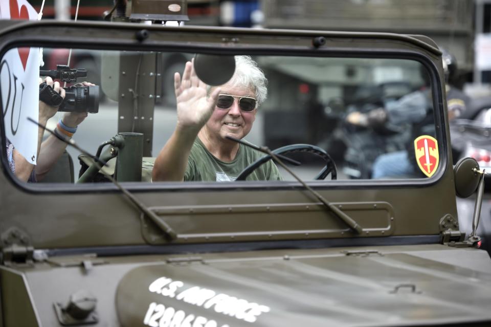 Former Augusta Mayor Bob Young waves from an old military Jeep as he leads the parade to support healthcare workers near the Children's Hospital of Georgia in Augusta, Ga., Monday morning July 6, 2020.