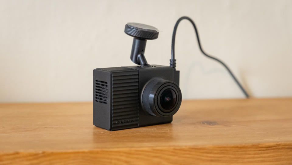 Garmin Dash Cam Tandem on a wooden surface