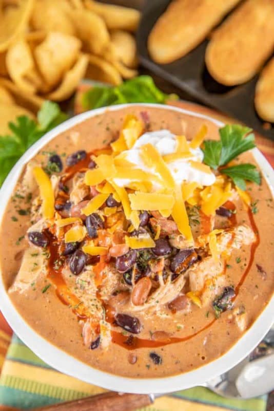 <p>Plain Chicken</p><p>A little bit of buffalo chicken dip, a little bit of chili and a whole lot of yum!</p><p><strong>Get the recipe: <a href="https://www.plainchicken.com/slow-cooker-buffalo-chicken-chili/" rel="nofollow noopener" target="_blank" data-ylk="slk:Slow Cooker Buffalo Chicken Chili;elm:context_link;itc:0;sec:content-canvas" class="link rapid-noclick-resp">Slow Cooker Buffalo Chicken Chili</a></strong></p>