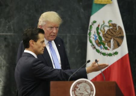 FILE PHOTO: U.S. Republican presidential nominee Donald Trump and Mexico's President Enrique Pena Nieto arrive for a press conference at the Los Pinos residence in Mexico City, Mexico, August 31, 2016. REUTERS/Henry Romero