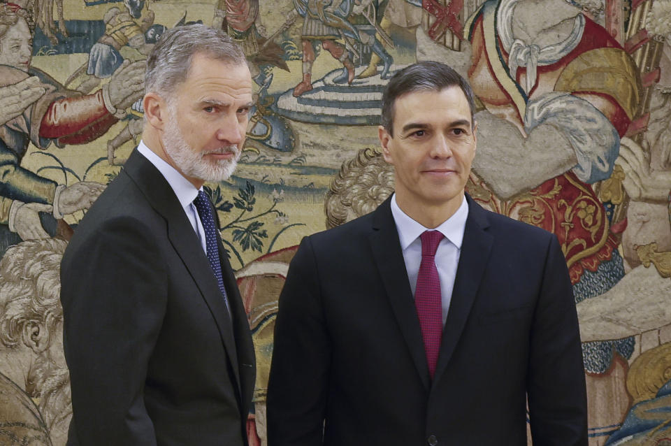 Spanish Socialist leader Pedro Sanchez, right, poses next to Spain's King Felipe after taking his oath of office during the swearing in ceremony at the Zarzuela Palace just outside of Madrid, Spain, Nov. 17, 2023. Sanchez has taken the oath after winning a parliamentary vote to form a new government centering almost entirely on an amnesty deal for Catalonia's separatists that secured Sanchez's vital support. (Ballesteros/Pool Photo via AP)