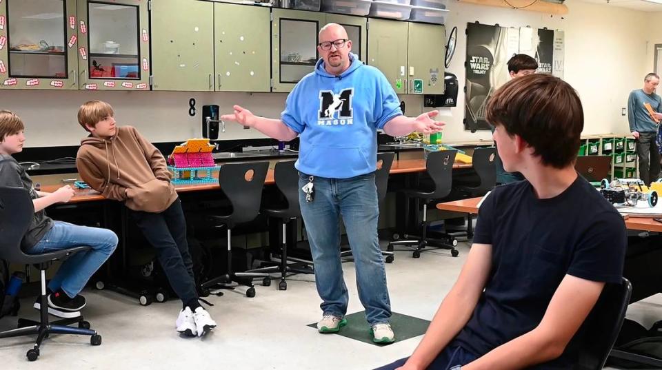 Robotics teacher Ian Chow-Miller fires up students before their annual robotics carnival demonstrating their Lego robot games at Mason Middle School in Tacoma, Washington, on Thursday, June 13, 2024.