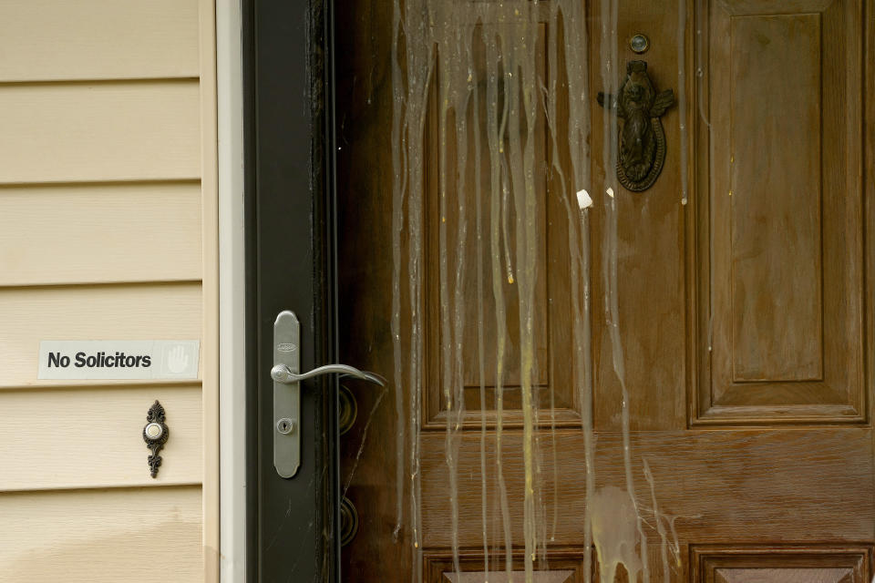 Dried eggs stains run down the front door, Wednesday, April 19, 2023, at the house where 84-year-old Andrew Lester shot 16-year-old Ralph Yarl a week earlier in Kansas City, Mo. (AP Photo/Charlie Riedel)