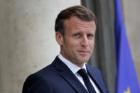 FILE - In this July 15, 2020 file photo, France's President Emmanuel Macron waits for Spanish Prime Minister Pedro Sanchez before a meeting at the Elysee Palace in Paris. French President Emmanuel Macron is traveling to Lebanon on Thursday to offer support for the troubled country after a massive, deadly explosion that has drawn global pledges of medical and humanitarian aid. (AP Photo/Christophe Ena, File)