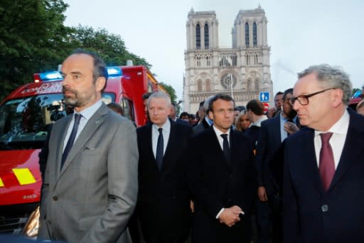 French Prime Minister Edouard Philippe (L) and French President Emmanuel Macron (3rd L) visited Notre-Dame