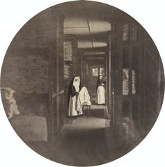 A photograph of two nuns working in a laundry.