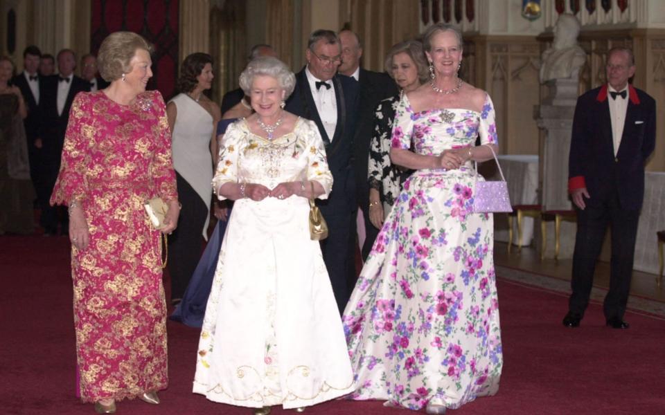 Queen Margrethe II with Queen Elizabeth II at Windsor Castle in 2002 - Martin Hayhow/AFP via Getty Images