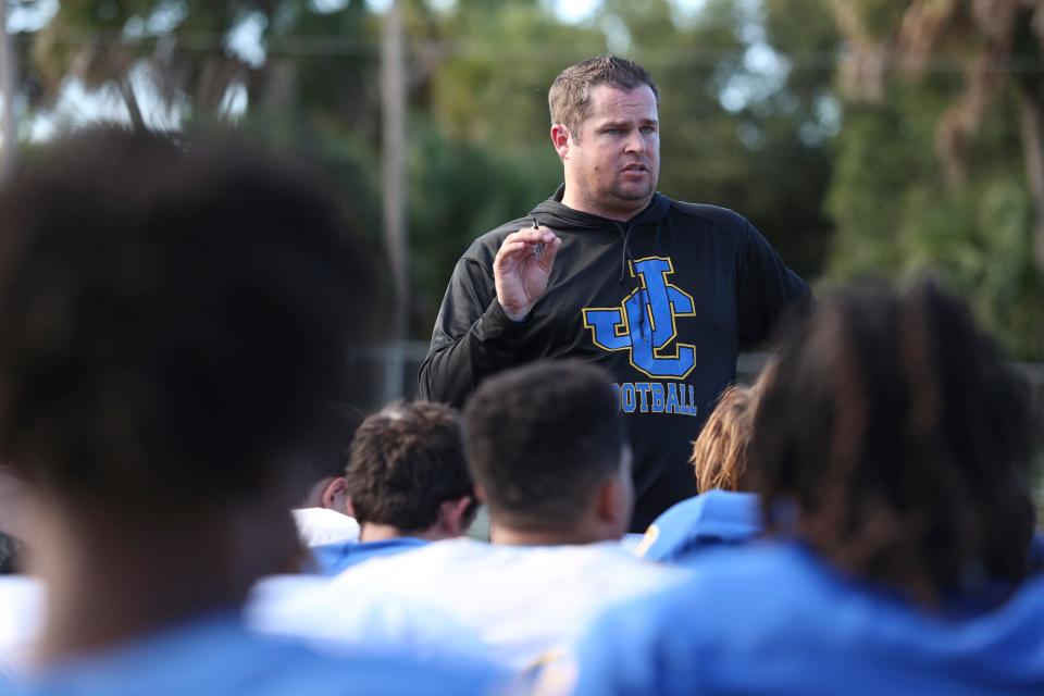 John Carroll Catholic football coach Mickey Groody speaks to his team after a scrimmage at John Carroll Catholic High School on Friday, Aug. 12, 2022. 