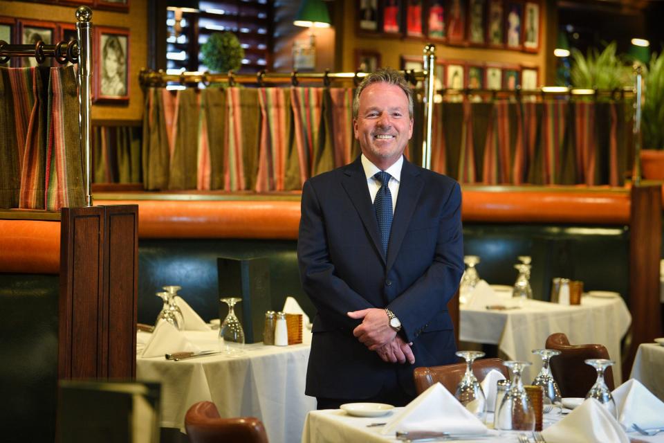 John Campbell, Co-owner of The River Palm Terrace, poses for photos at the dining room of The River Palm Terrace in Edgewater, Thursday on 04/14/22.