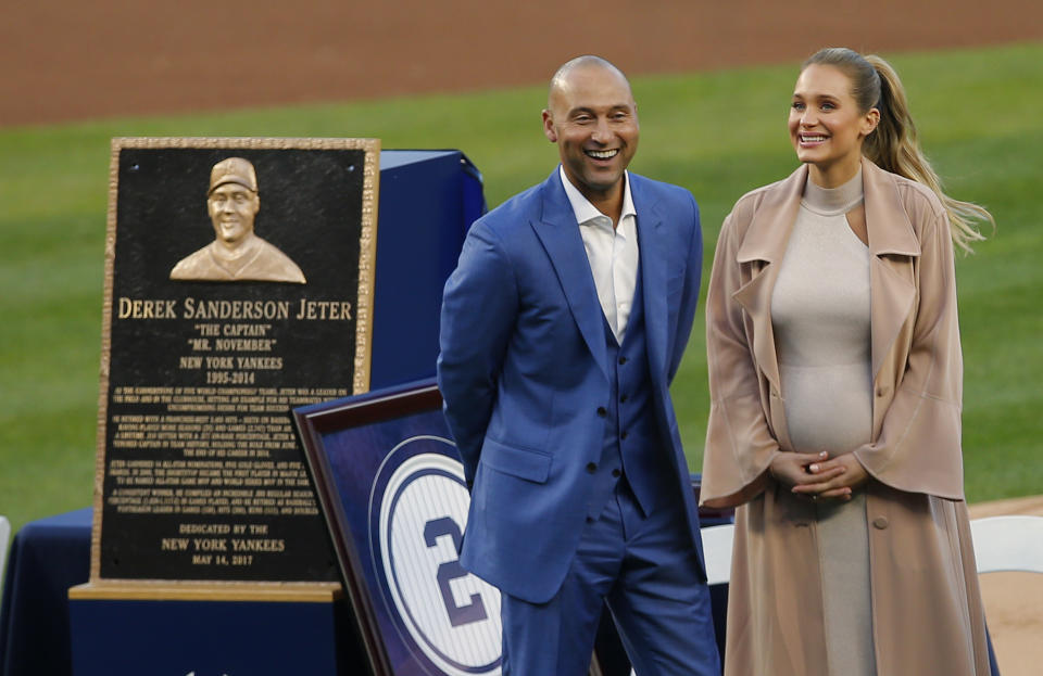 NEW YORK, NY - MAY 14: Former New York Yankees great, Derek Jeter and his wife Hannah pose in front of his plaque during a pregame ceremony honoring Jeter and retiring his number 2 at Yankee Stadium on May 14, 2017 in New York City. (Photo by Rich Schultz/Getty Images)