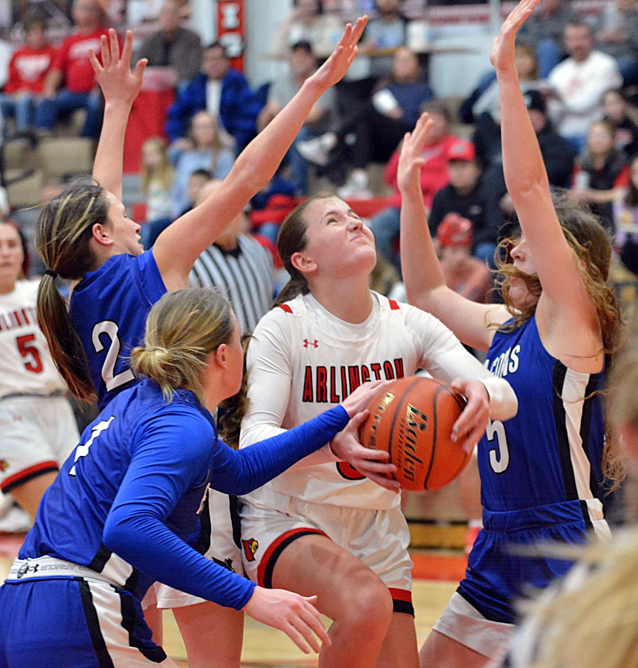 Arlington's Addie Steffensen is surrounded by Florence-Henry defenders Ashlynn Vavruska (2), Haley Hlavacek (1) and Taylor Watson during their high school girls basketball game on Tuesday, Jan. 23, 2024 in Arlington. Arlington won 51-44.